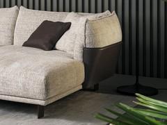 The armrest-cushion is delicately inserted into the leather upholstery 'shell'.