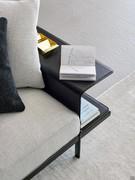 Detail of the hide leather armrest magazine rack, an accessory which heightens the functionality and originality of Phil