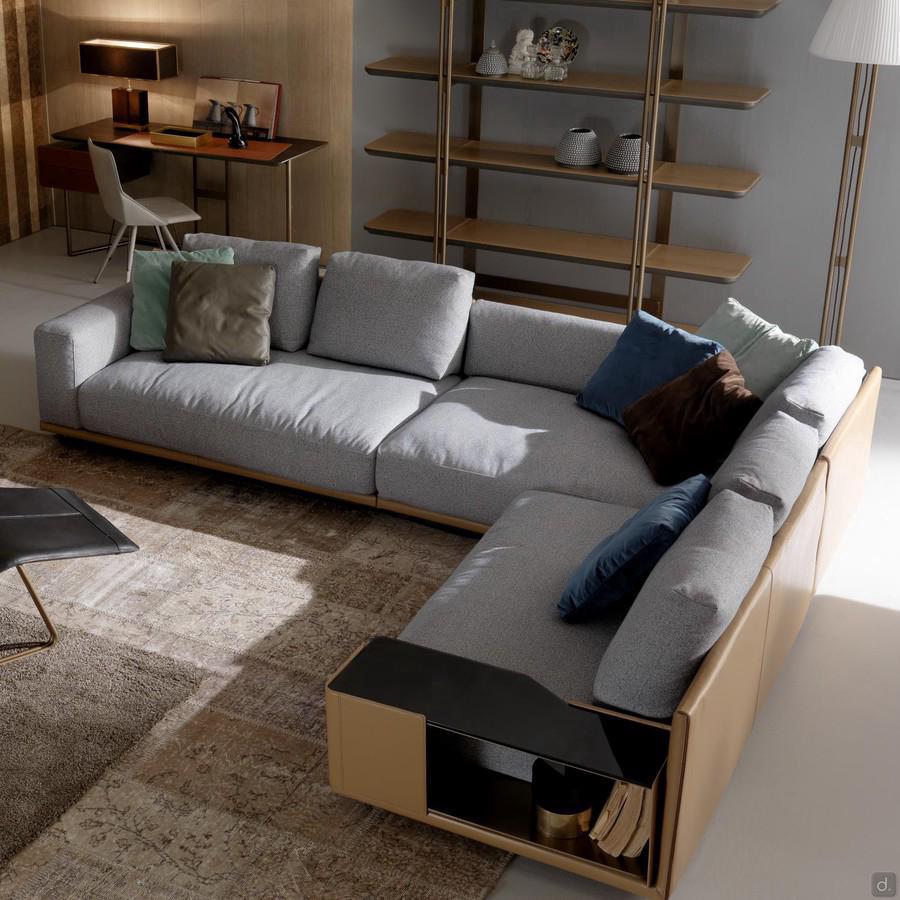Victor modern luxury sofa with structure covered in leather and cushions in fabric
