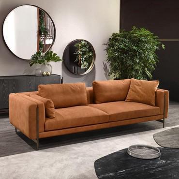 Shanghai designer sofa by Cantori with high wrought iron feet