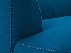 Detail of the armrest with contrast stitching, a distinctive feature of the Goya sofa