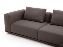 Detail of the wide seats, with armrest and backrest at the same height and back cushions in support