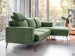 Side view where you can perceive the 'suspended from the ground' effect given by the high anthracite painted metal feet. Also in the foreground is the optional headrest