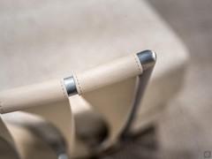 Detail of the bands made of leather or imitation leather, twisted and with fine matching stitching