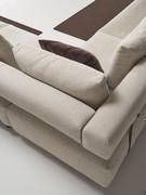 Detail of the juxtaposition of the padded backrests suspended above the seats on which the back cushions rest