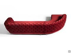 Rear view of the Oban sofa with capitonné backrest and smooth seat shown here with curved peninsula