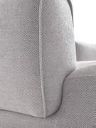 Detail of the upholstered armrest connection on the seat
