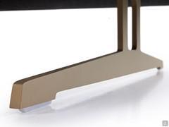 Detail of the metal sled, shown here in Sand Gold finish, which lifts the sofa off the floor