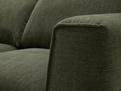 Detail of the tailoring of the fabric lining, with embossed stitching along the armrests