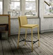 Scotland stool with upholstered legs and footrest in black, varnished metal