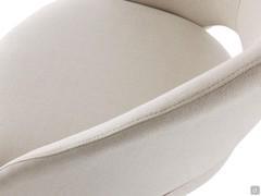 Stitching and openings on the back of the Niva stool, upholstered in fabric but also available in velvet or imitation leather