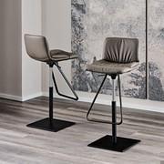 Alex stool by Cattelan in the version with central square base, in black embossed metal, and seat covered in leather