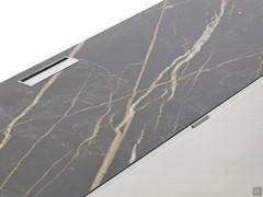 Gorgeous ceramic stone top, equipped with a cable hole. Front with micro-perforated door in matte lacquer.