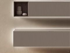 Suspended flap base unit combined with suspended wall unit complete with open compartment. Lacquered matt hazelnut finish with 10:2 front processing.