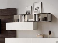 Freehand suspended horizontal storage unit, used as an open compartment in a fitted wall context with panelling and wall units