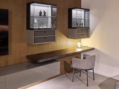 Home office corner with suspended desk integrated into the wooden panelling