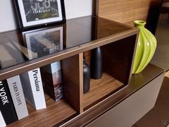 Detail of the wood and metal open element, embellished with an elegant glass top available in transparent or smoked finish
