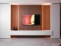 The central part of the Lounge 02 wall with wall-hung base units and backlit wall paneling with suspended TV: an elegant combination of linen matt lacquered furniture and tobacco oak veneer wall panels