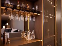 Interior of the wardrobe column with Stop Sol bronze glass doors: note the mirrored back panel and the brass metal lacquered wooden cupboard shelf