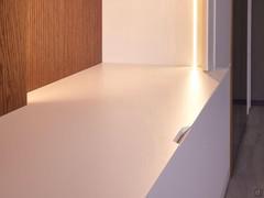 Detail of the workmanship on the tops and fronts of the wall-hung base units that creates a 'pocket' to facilitate opening