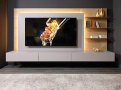 Replay 09 living room wall unit with a TV panel with optional LED backlighting, the elegant effect of the soft light reflected on the wooden paneling is appreciated