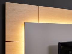 Detail showing the soft effect of indirect LED lighting on the wooden panels of the wood paneling