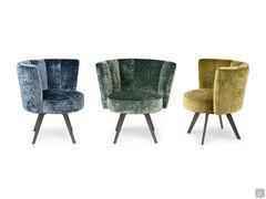 Fauteuils Petra à dossier en coquille, disponibles avec un revêtement en velours dans différentes couleurs.