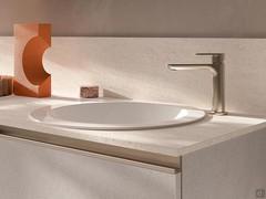 Lavabo rond modèle Spazio encastré au-dessus du plan de travail entièrement en céramique blanche polie