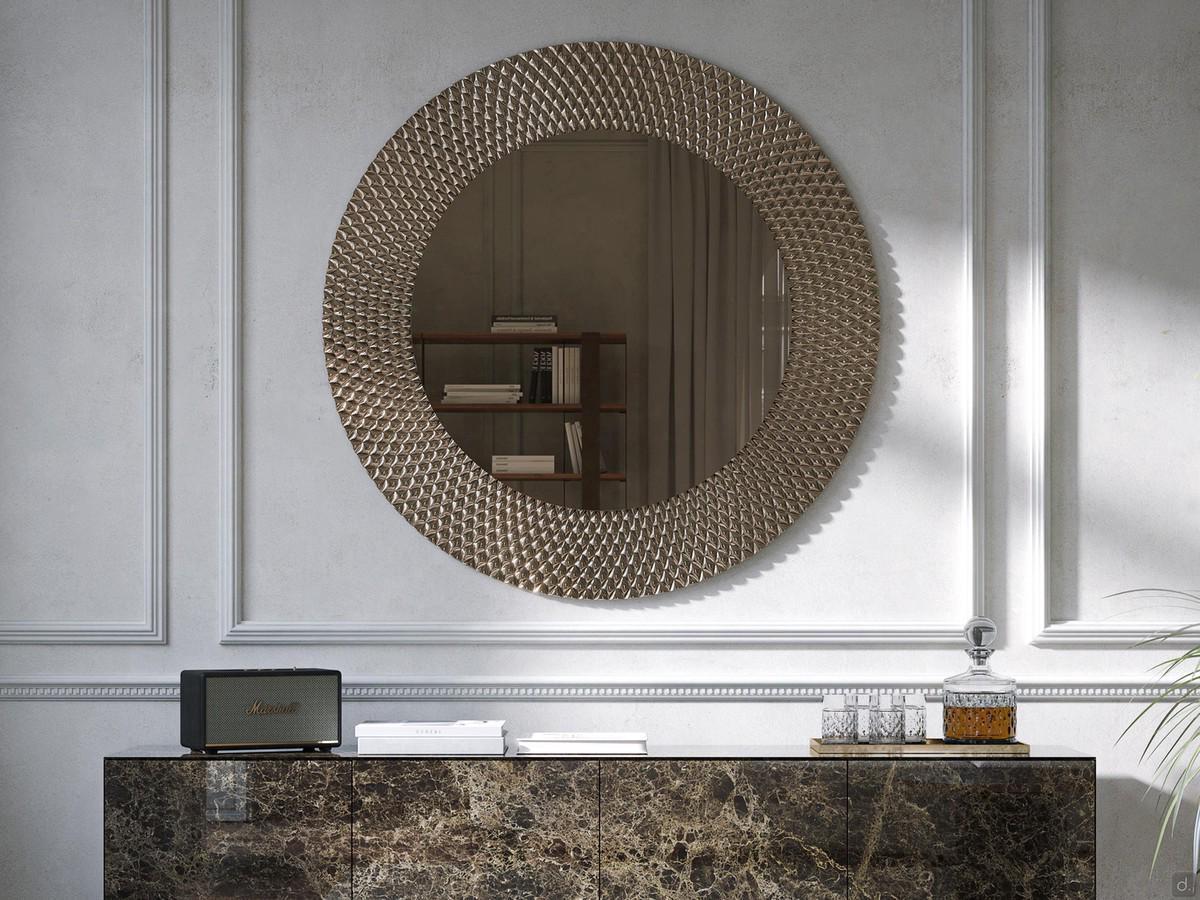Miroir rond avec cadre en bronze Talete présenté ici avec un buffet