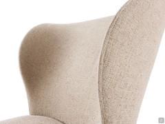 Détail du large dossier et des ailes latérales caractéristiques du fauteuil bergère Spring outlet
