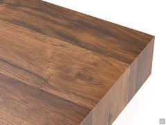 Détail du plateau en placage caissonné qui dissimule le mécanisme d'extension télescopique synchronisé à l'intérieur.