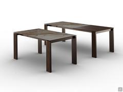 Sur cette photo, on peut voir la table Marshall avec sa base en métal bronze, son insert canulé et son plateau en vitrocéramique patagonia brillant.