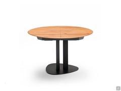 Table de salle à manger Laredo en bois massif au format rond extensible, base en métal peinte en noir pour s'harmoniser avec le mécanisme d'extension.