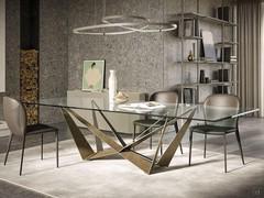Table Skorpio avec plateau en verre extra-clair et piètement en bronze brossé