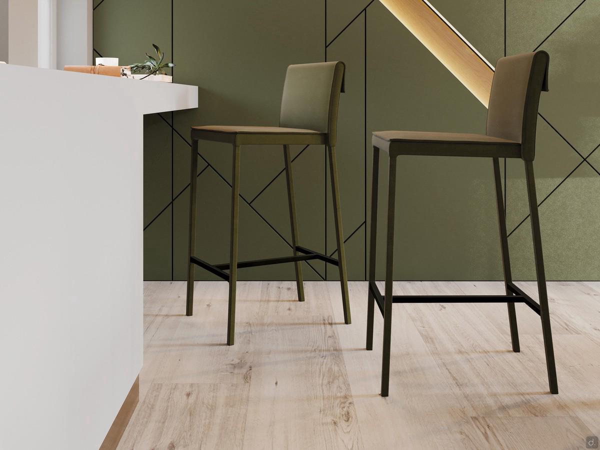 Tabouret fixe revêtu de similicuir ou de tissu écossais, avec cadre revêtu d'un tissu assorti à l'assise.