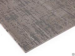 Détail du tapis à poils courts avec un motif abstrait tacheté