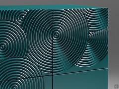 Dettaglio delle lavorazioni circolari sulla credenza Crop, carteggiate a mano prima della laccatura in colore Graublau