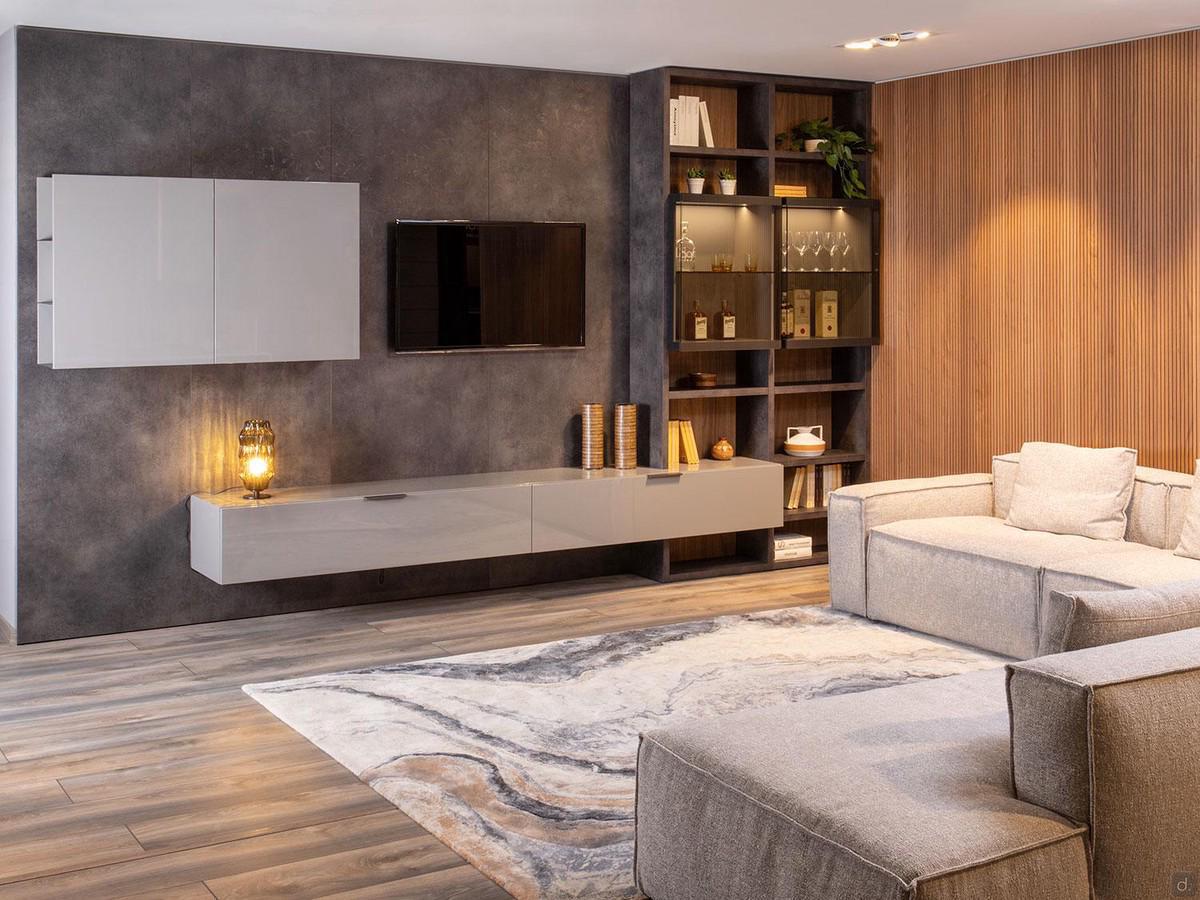 Parete attrezzata Plan 39 outlet con boiserie a tutta altezza, basi sospese a cassetto, pensili e libreria laterale