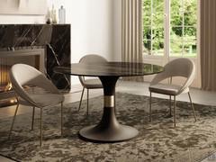 Tavolo rotondo da soggiorno Calice con piano in vetro ceramica noir desire abbinato al basamento in metallo verniciato nero con inserto champagne