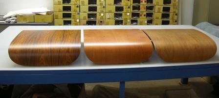 Fauteuil Eames: coques en palissandre, cerisier et noyer clair mises côte à côte