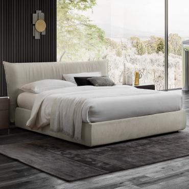 Letto imbottito di design con piedini alti Panama