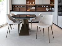 Table de salle à manger design extensible avec chaises et petits fauteuils élégants 