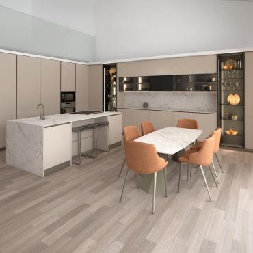 Grande composizione cucina angolare con isola operativa. Zona completa di tavolo e sedie.