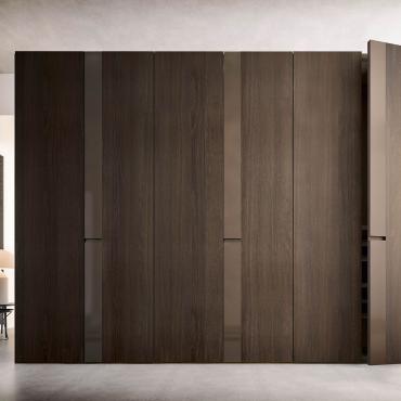 Slice is a hinged wardrobe with decorative band
