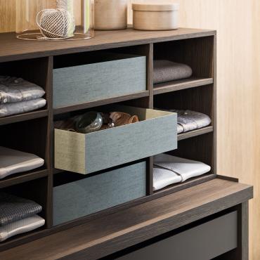 Shirt cubbies in Dormouse oak wood, complete with fabric-covered storage boxes