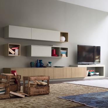 Plan 23 wall system with neutral colours composed of wall units, cabinets, open compartments and C-shaped element