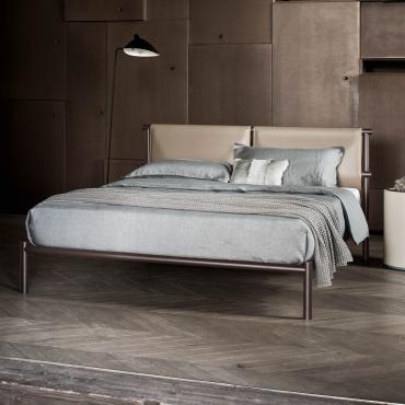 Skinny minimalist bed with hide leather headboard