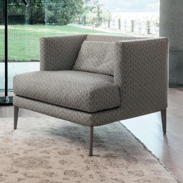 Paraiso stylish upholstered armchair with low backrest and visible feet