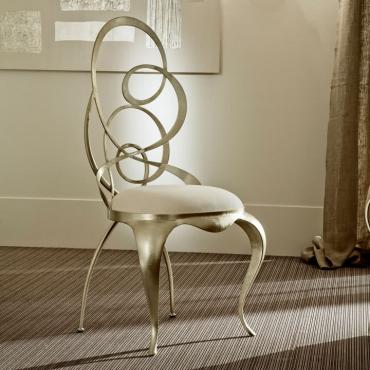 Ghirigori chair with sabre-shaped legs