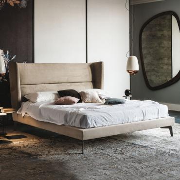Ludovic bed with high winged headboard by Cattelan. Nubuck cover also available in fabric, faux leather or leather for a refined bedroom